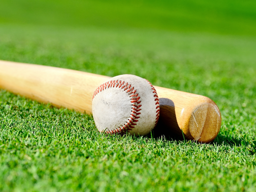 wooden-baseball-bat-on-field