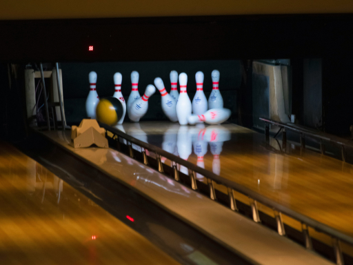 a-bowling-ball-hits-the-target-bowling-pins