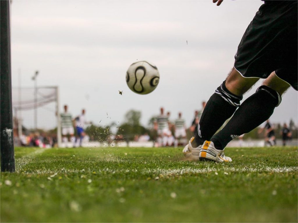 people-kicking-soccer-ball